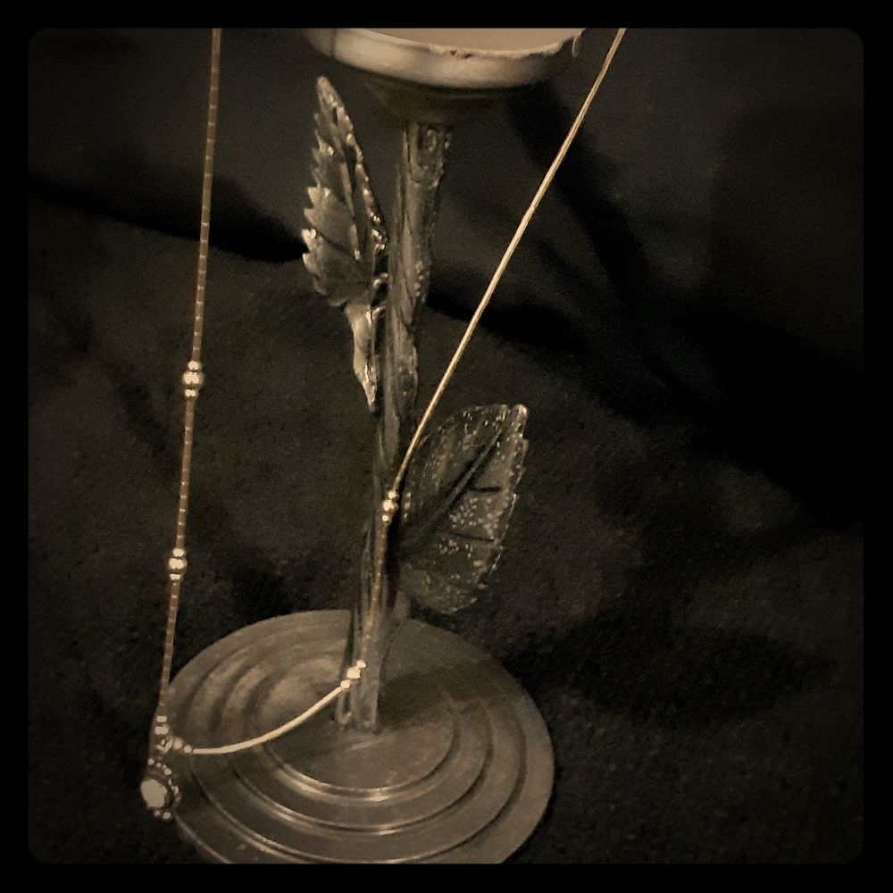 Petite silver mother of pearl pendant on a 14" ch